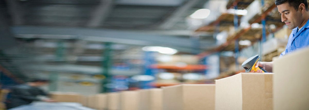 Warehouse worker scanning box